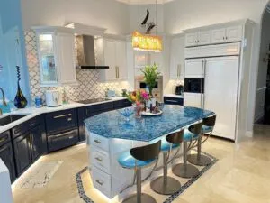 White and navy blue painted kitchen cabinets with gold hardware in a Jacksonville FL home by New Empire Remodeling